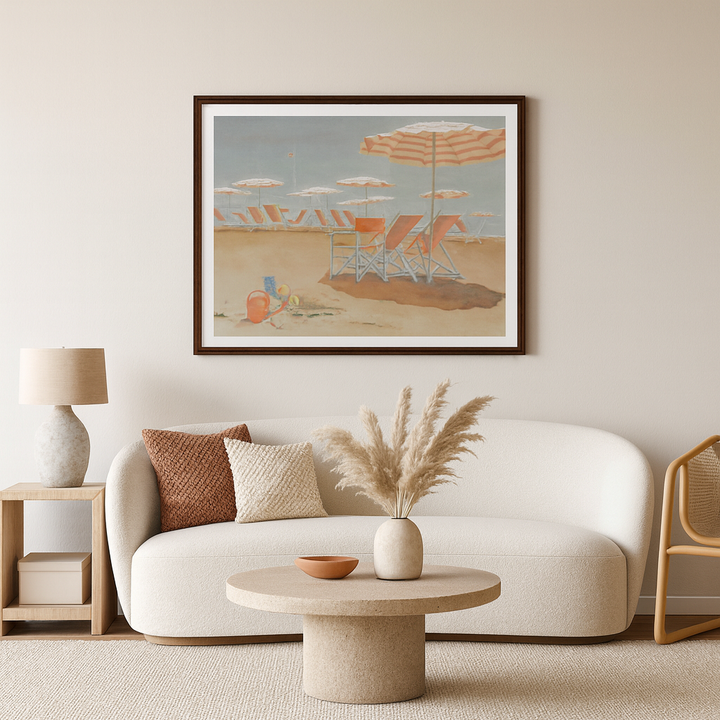 Living room with a framed beach scene painting print on the wall, white sofa, and decorative elements - by Veronique Semple on Bromont Media