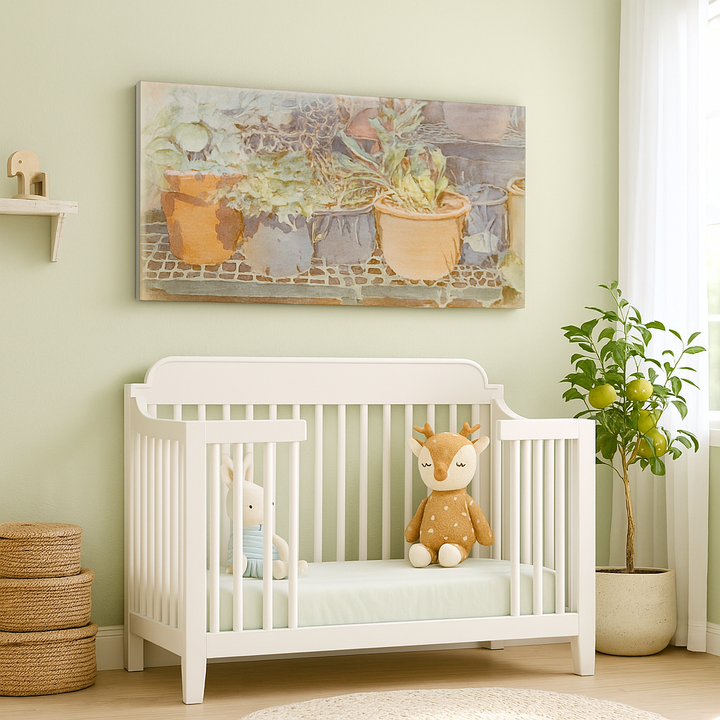 White crib with stuffed animals in a nursery with a painting of potted plants - by Veronique Semple on Bromont Media