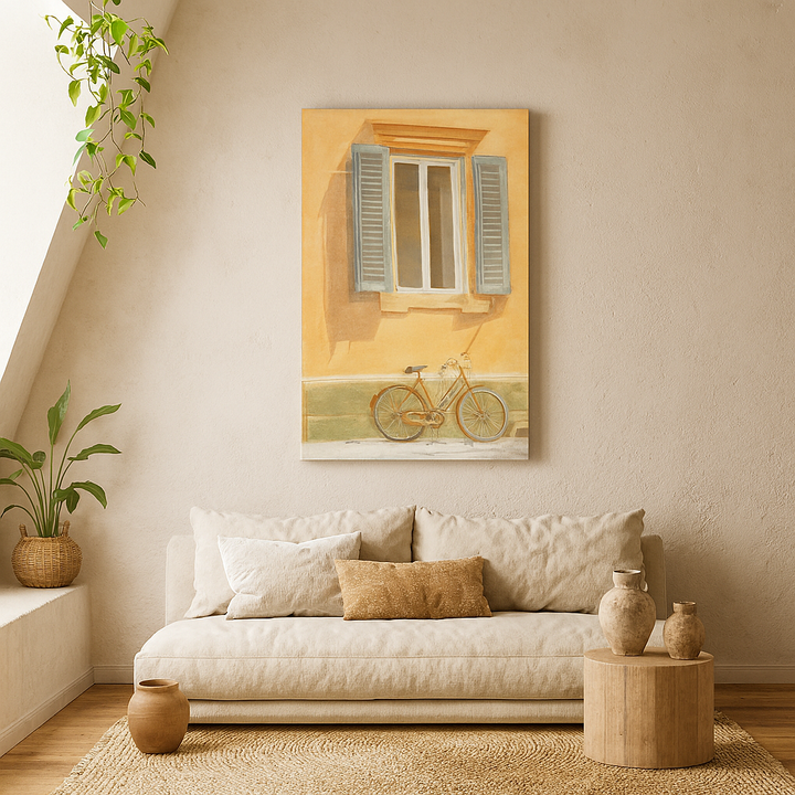 Living room with a beige sofa, decorative pillows, and a wall painting of a bicycle by a window - by Veronique Semple on Bromont Media