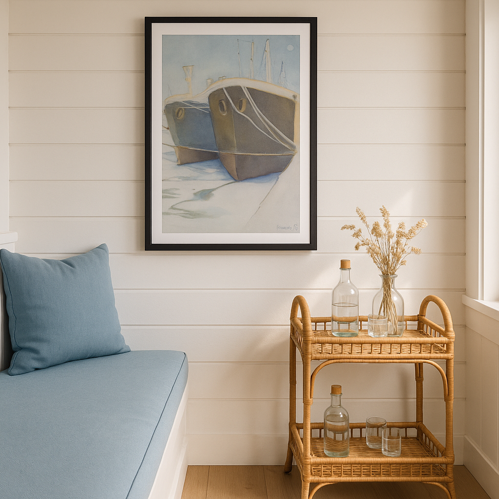 Nautical-themed room with a framed painting of boats, a blue cushioned bench, and a rattan bar cart.