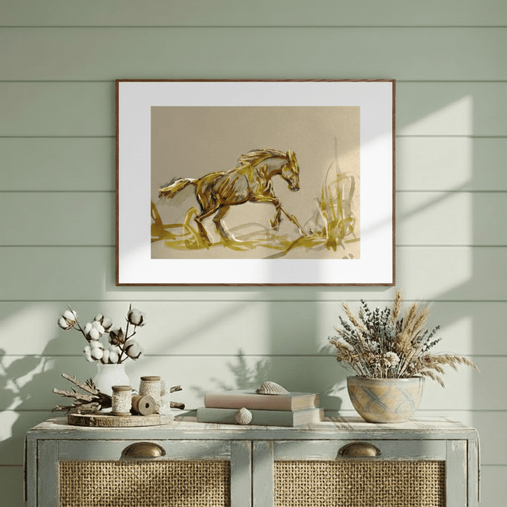Framed artwork of a horse on a wall above a console table with decorative items - Bromont Media