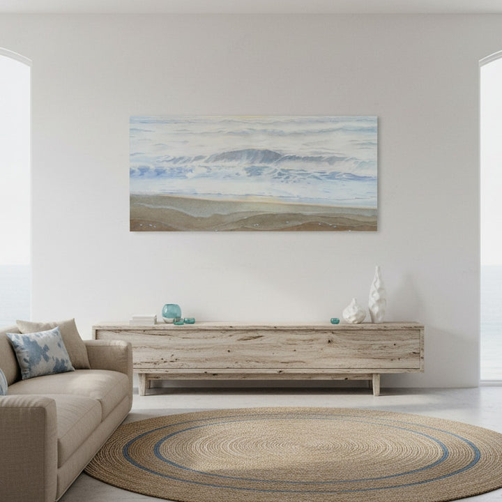 Living room with a beige sofa, wooden coffee table, and a large watercolor painting on the wall.