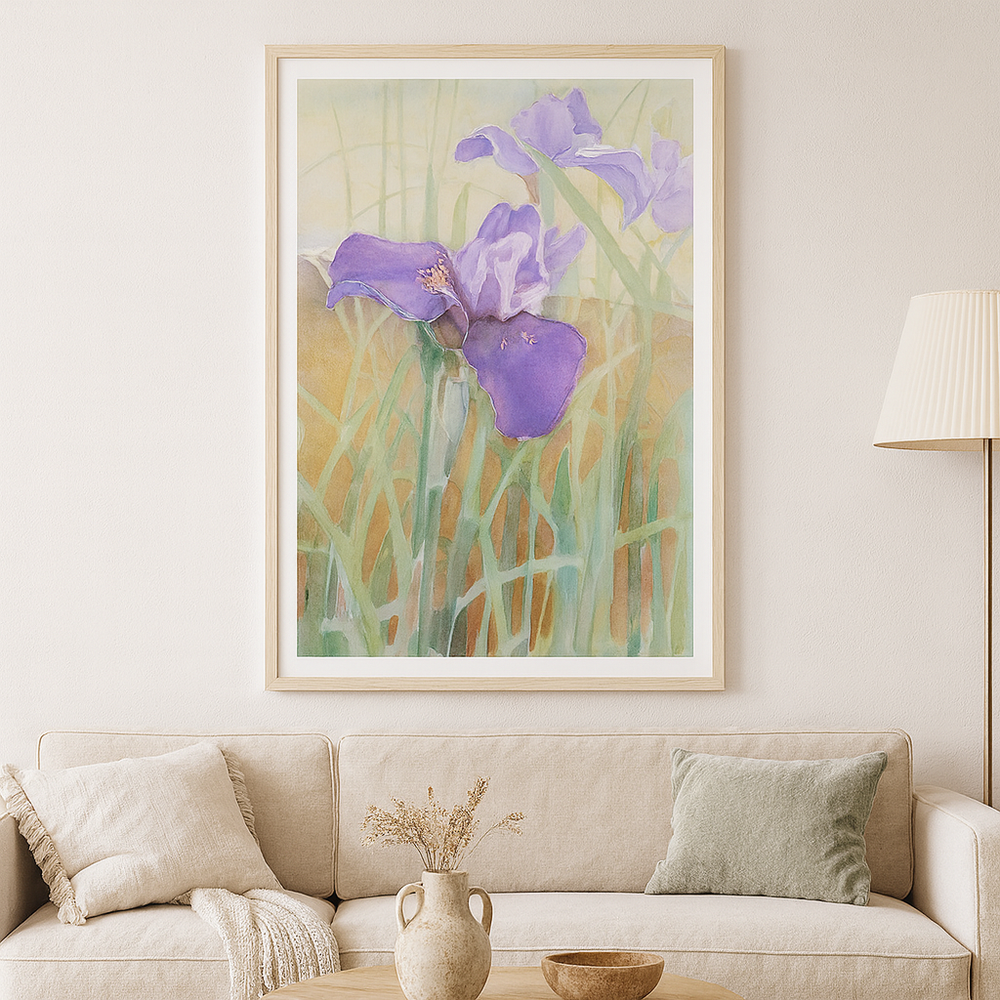 Framed artwork of purple flowers on a wall above a beige sofa - Bromont Media