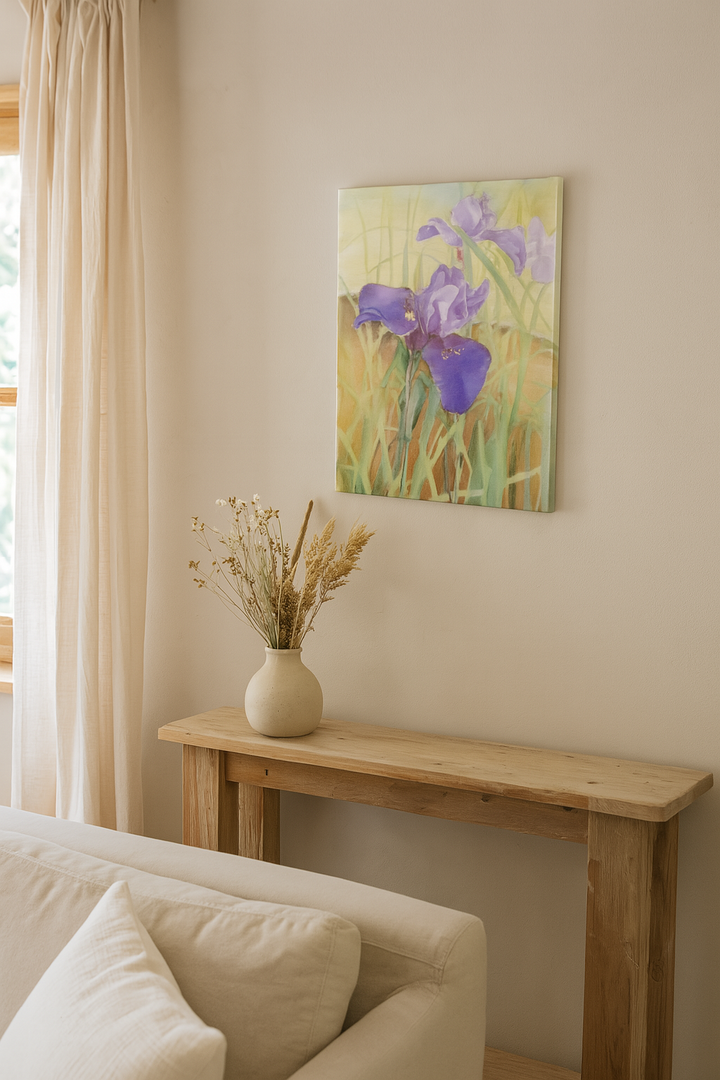 Wooden console table with a vase of flowers next to a painting of irises on a wall.