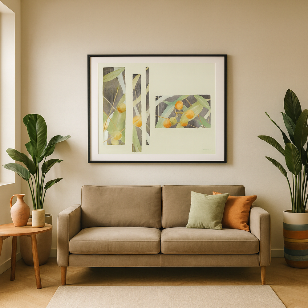 Living room with beige sofa, decorative pillows, and vintage framed artwork on a beige wall - Bromont Media