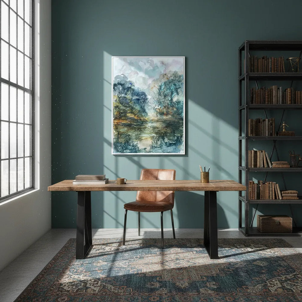 Modern home office with wooden desk, leather chair, and bookshelf against a green wall - Bromont Media