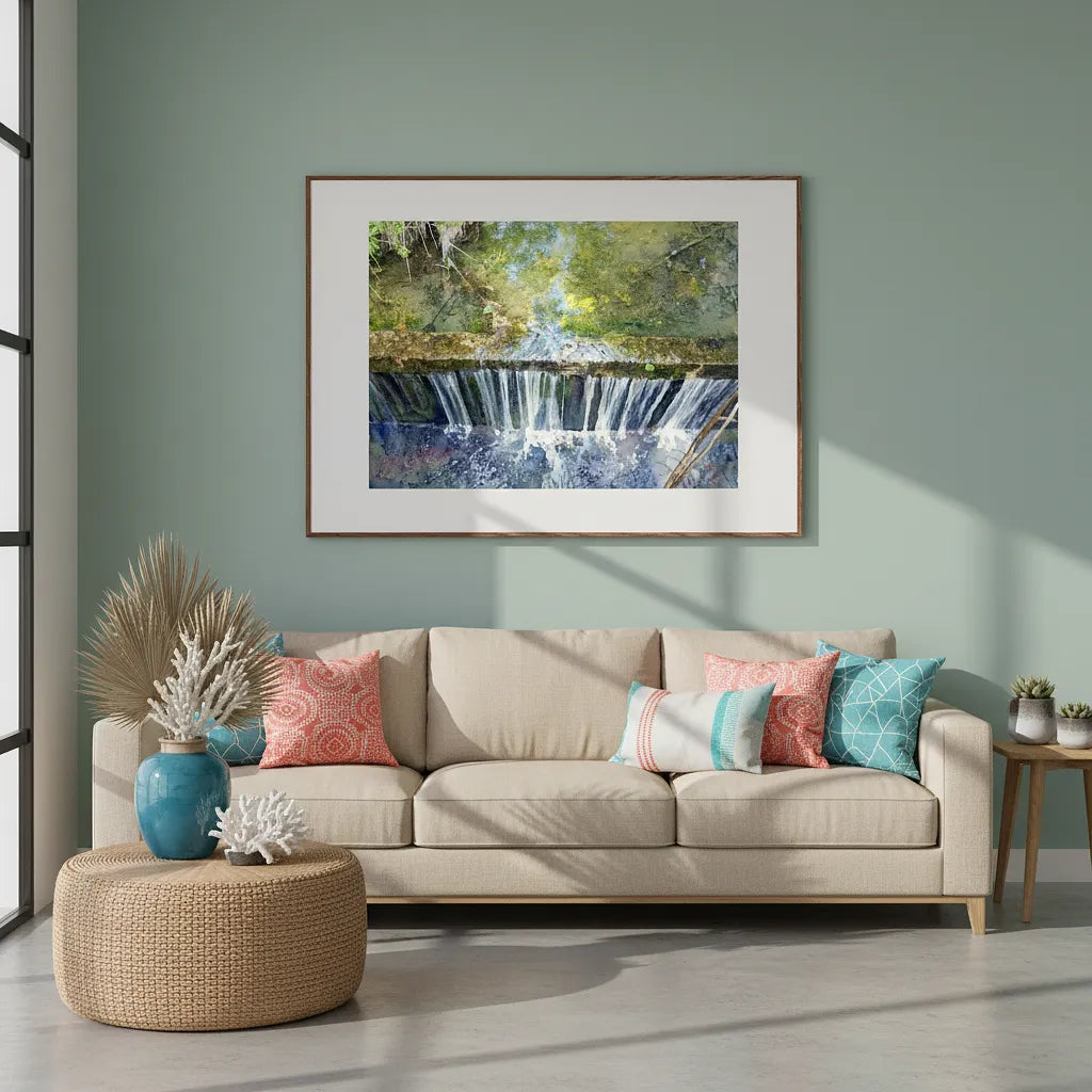 Living room with beige sofa, colorful pillows, and a framed picture of a waterfall on the wall - Studio Shefford