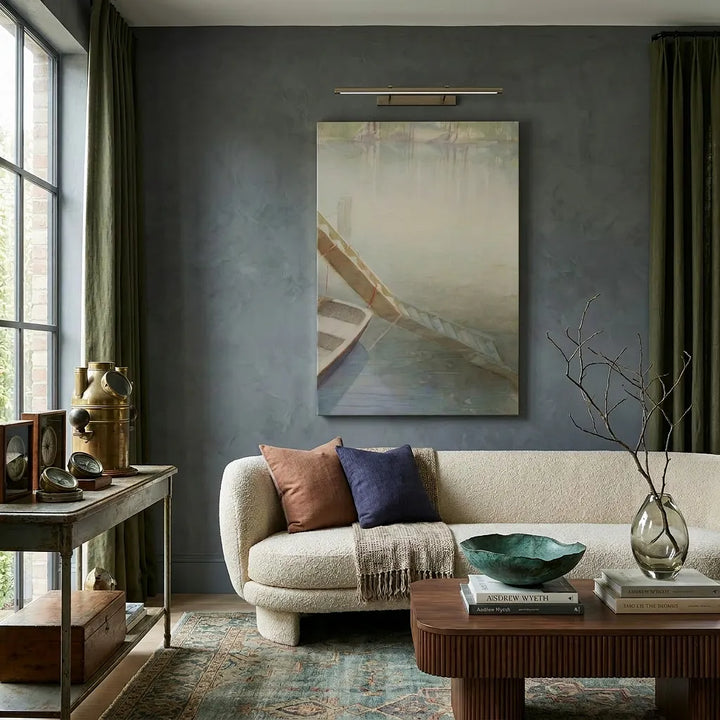 Living room with a couch, coffee table, and wall art by Bromont Media