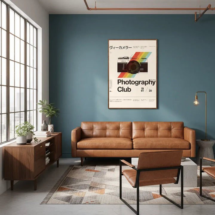 Modern living room with a brown leather sofa, wooden console, and &