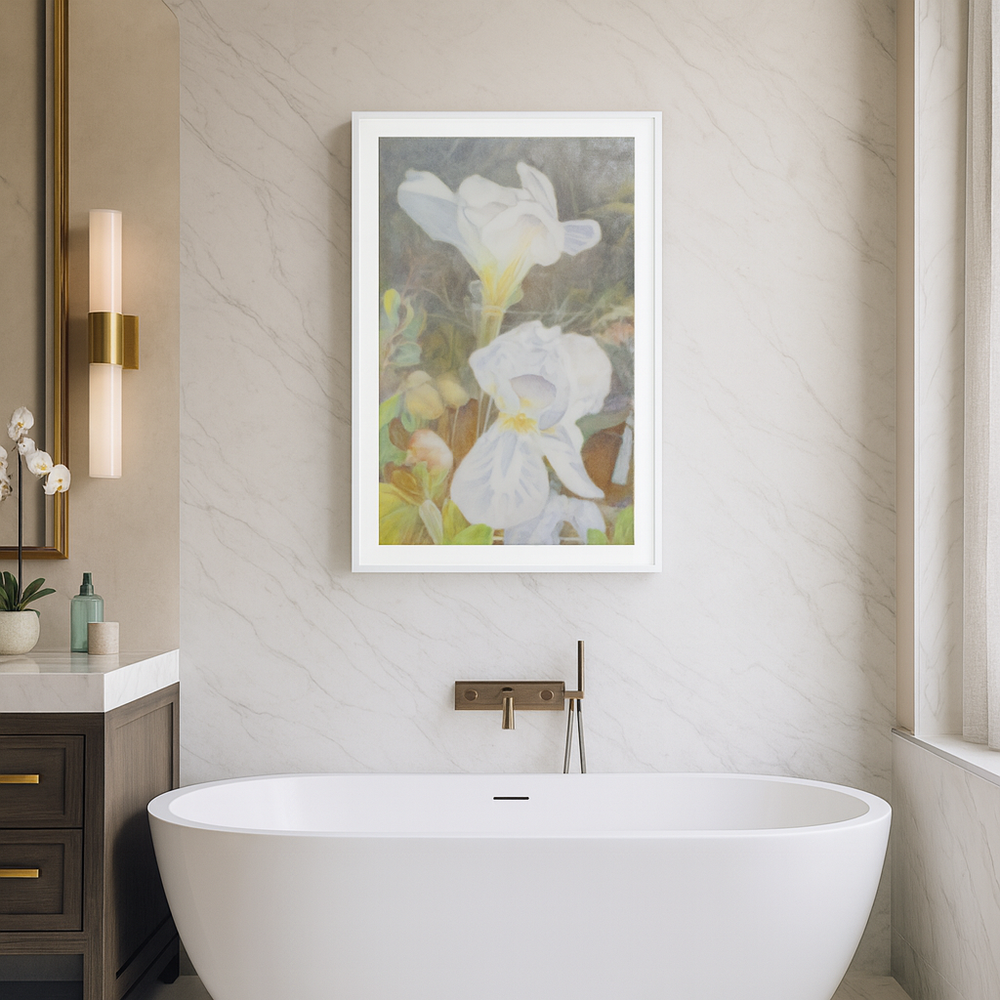 Bathroom with a freestanding bathtub, framed floral art on the wall, and a sink - Bromont Media