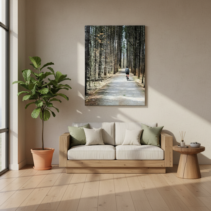 Wellness center with a sofa, plant, and wall art of a forest path - by Studio Shefford on Bromont Media