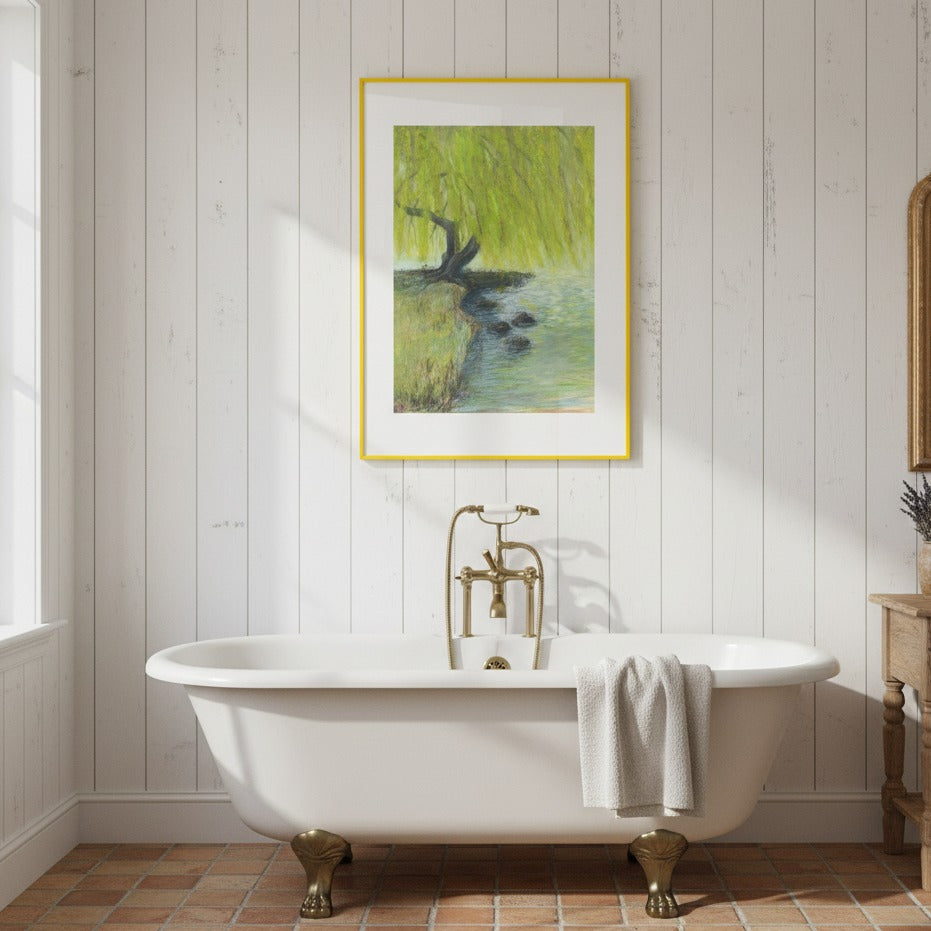 Bathroom with a freestanding bathtub, gold faucet, and framed artwork on the wall.
