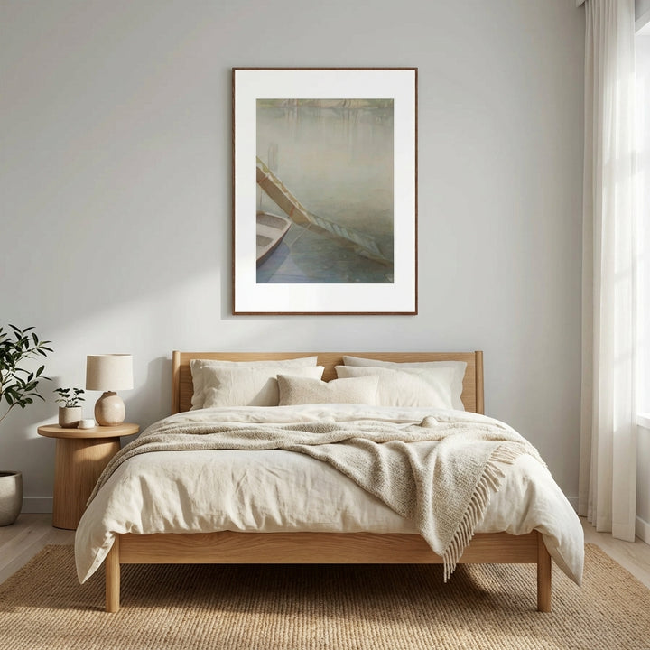 Bedroom with wooden bed, beige bedding, and framed artwork on the wall.