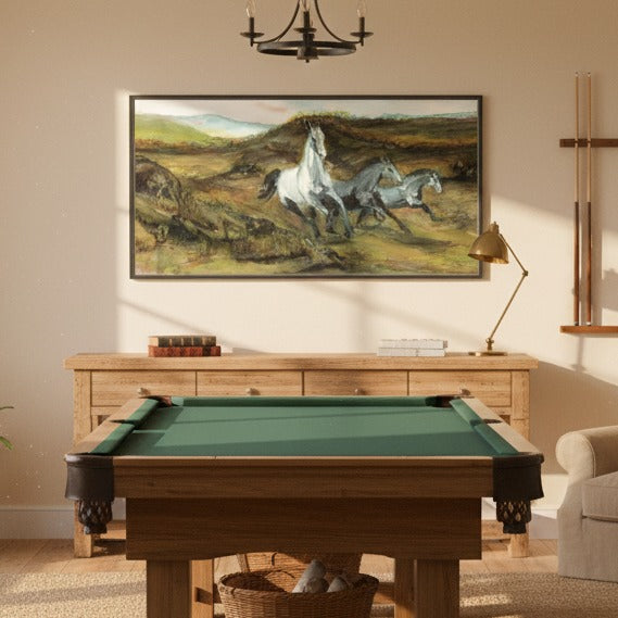 Pool table in a room with a painting of horses on the wall - Bromont Media
