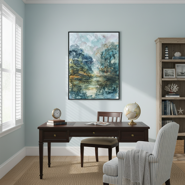 Home office with a desk, chair, and wall art in a room with light blue walls - Bromont Media
