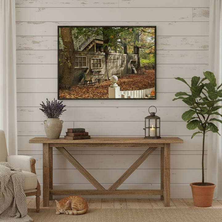 Living room with a wooden console table, a cat, and a framed picture on wall by Bromont Media