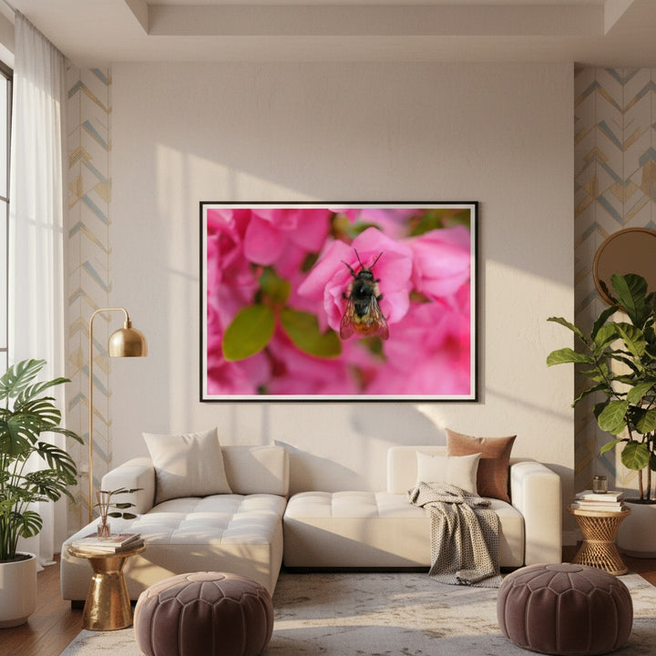 Living room with a white sofa, decorative pillows, and a large framed photograph of pink flowers on the wall by Andrew Semple - Bromont Media