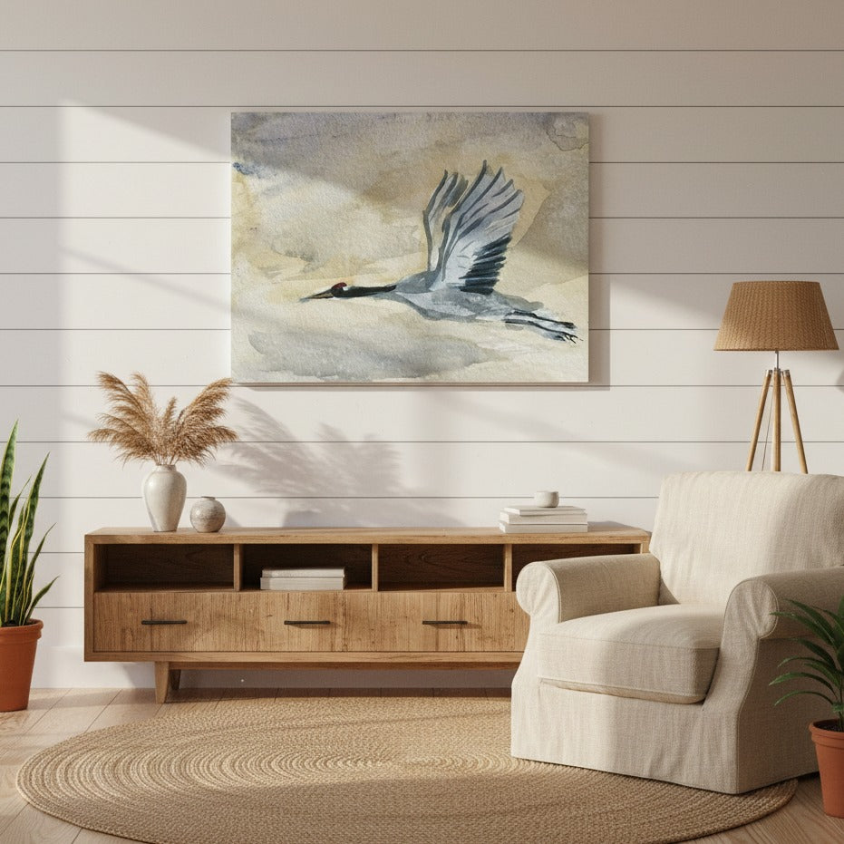 Living room with a beige armchair, wooden cabinet, and a painting of a Blue Huron on the wall by Andrew Semple - Bromont Media