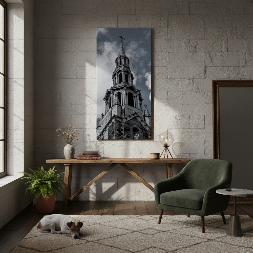 Living room with a green armchair, wooden table, and a large wall art of a chruch steeple by Studio Shefford