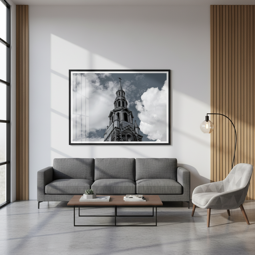 Modern living room with a gray sofa, armchair, and framed picture of a church steeple on the wall. - Studio Shefford