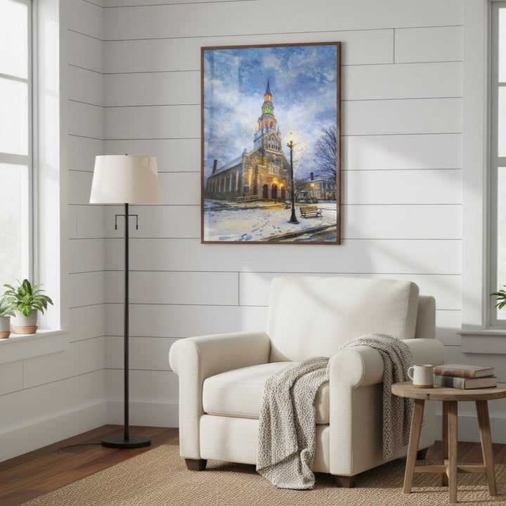 Living room with a white armchair, lamp, and framed picture of a snowy scene by Studio Shefford
