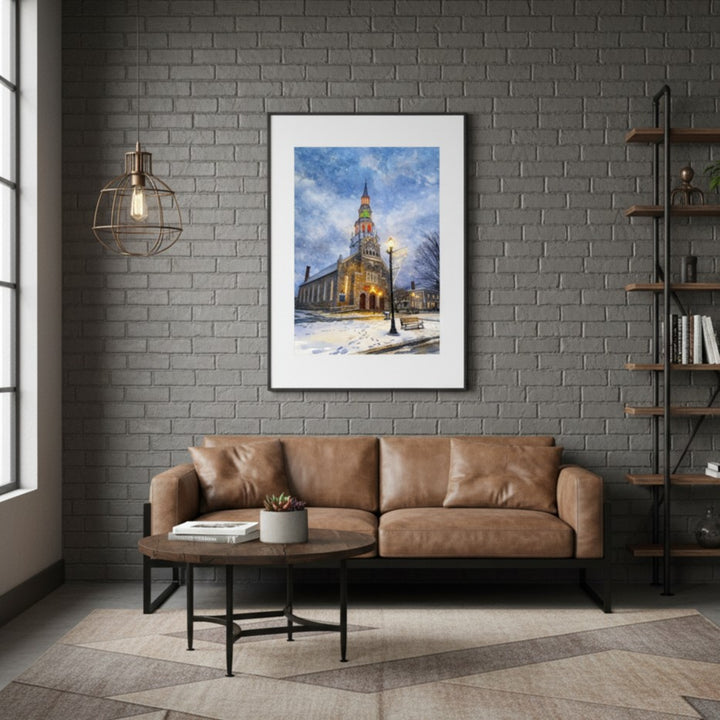 Living room with a brown leather sofa, round wooden coffee table, and framed picture on a gray brick wall.