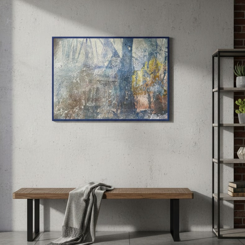 Abstract painting on a wall above a wooden bench in a room with a bookshelf.