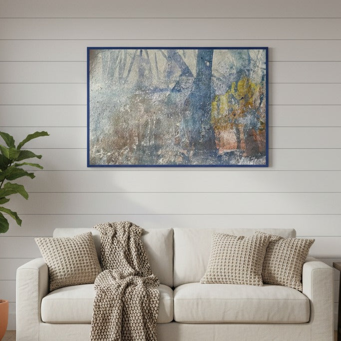 Living room with a beige sofa, textured pillows, and an abstract painting on the wall - Bromont Media