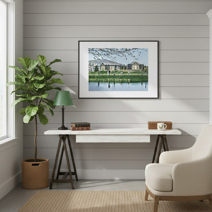 Modern interior with a framed picture, plant, lamp, and chair against a wooden paneled wall - Studio Shefford