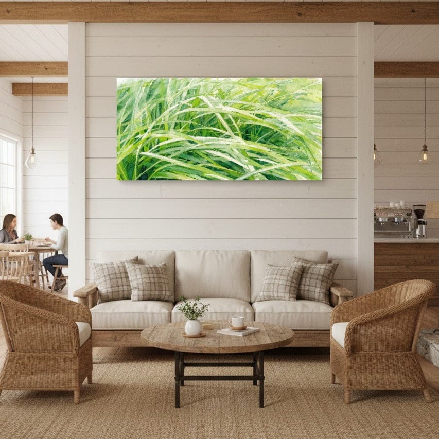 Living room with a large green abstract nature painting on the wall, beige sofa, and wicker chairs.