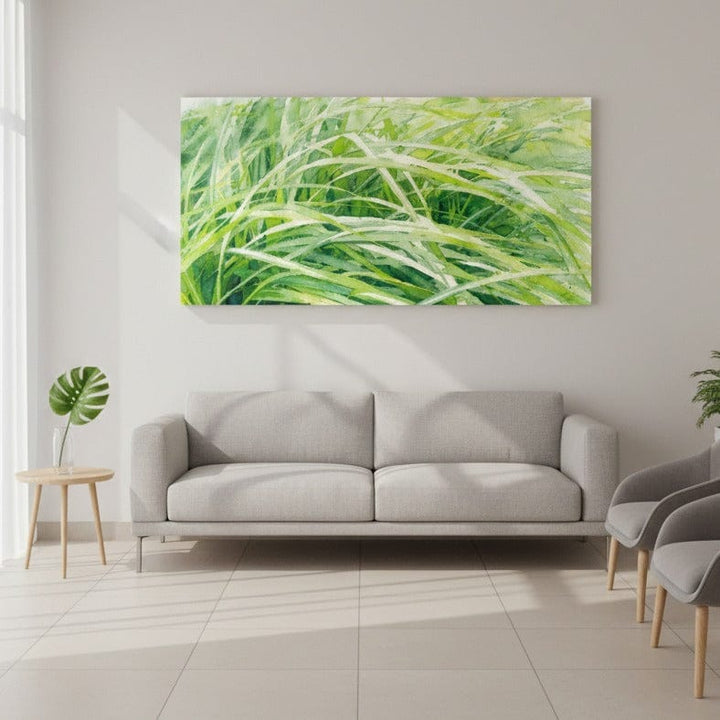 Living room with a gray sofa, small table, and chair, featuring a large green Watercolor Nature Art by Studio Shefford on the wall.