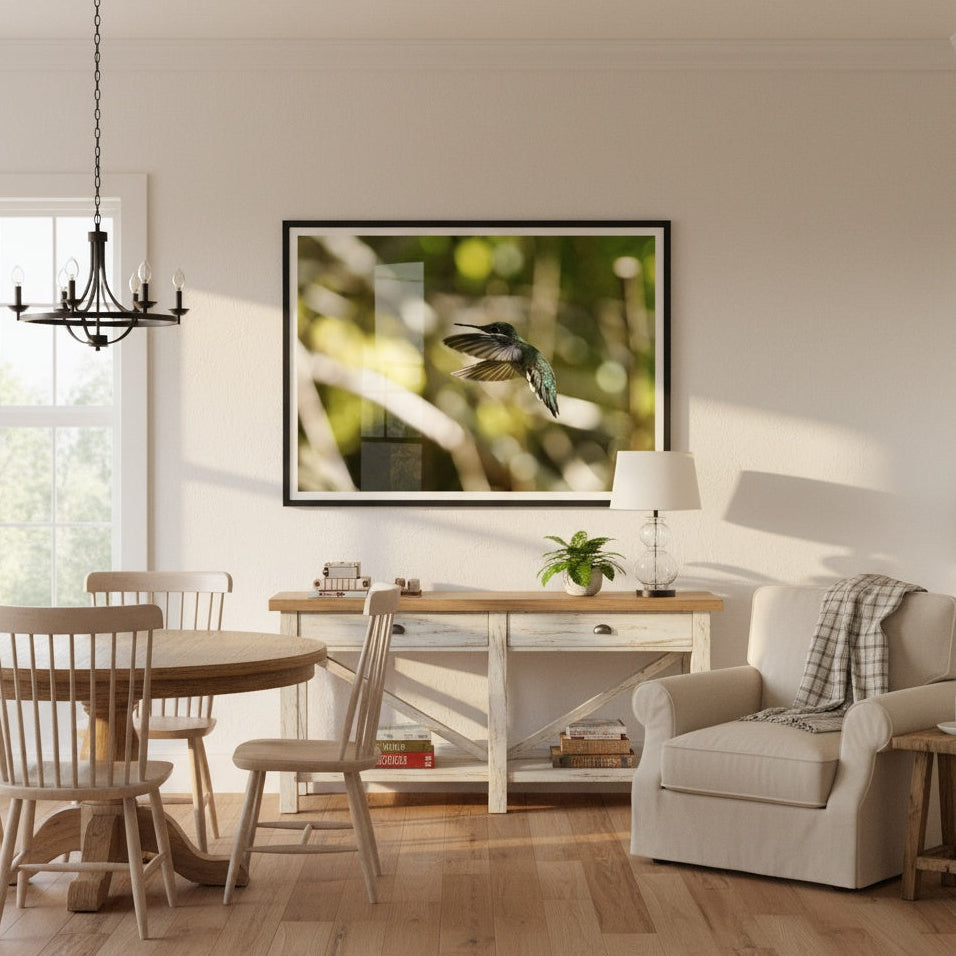 Living room with a dining area, framed artwork on the wall, and a comfortable armchair - phto by Andrew Semple