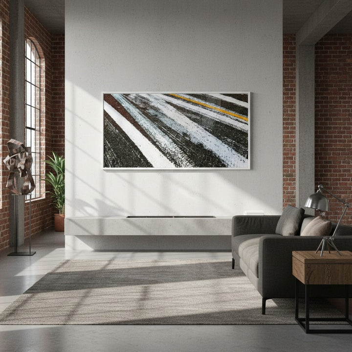 Modern living room with abstract painting on the wall, sofa, and coffee table - Bromont Media