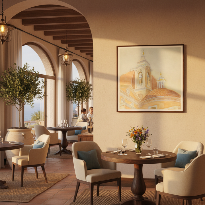 Lovely mediterannean-style hotel restaurant with framed artwork of a bell tower on the wall - by Veronique Semple on Bromont Media
