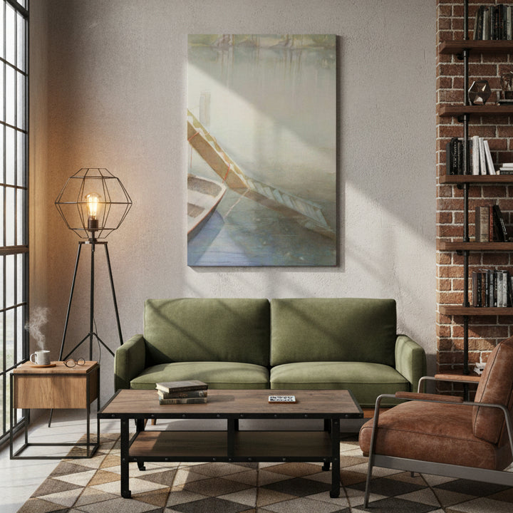 Modern industrial style living room with green sofa, brown armchair, and watercolor painting on wall.