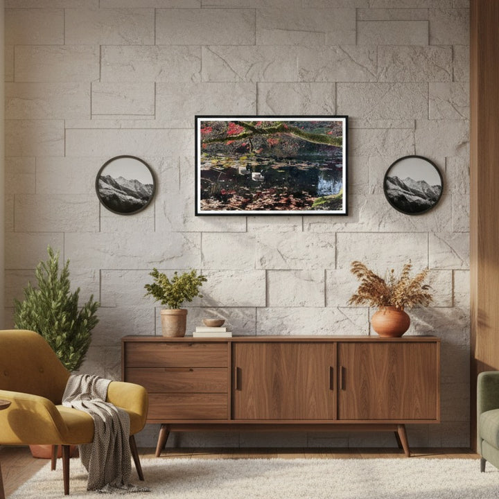 Living room with wooden cabinet, decorative plants, and framed photograph on a stone wall - by Andrew Semple on Bromont Media