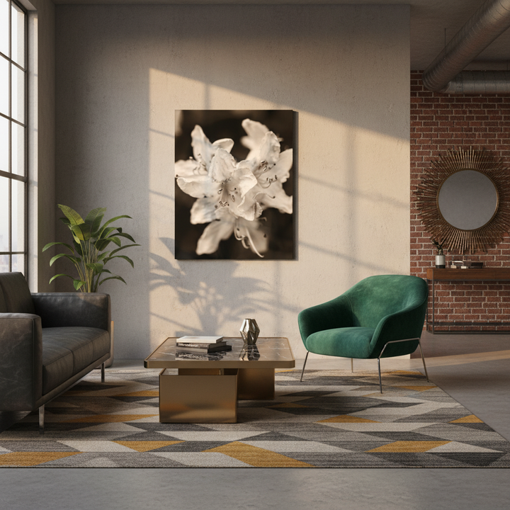 Modern living room with a green chair, gray sofa, and floral artwork on the wall.