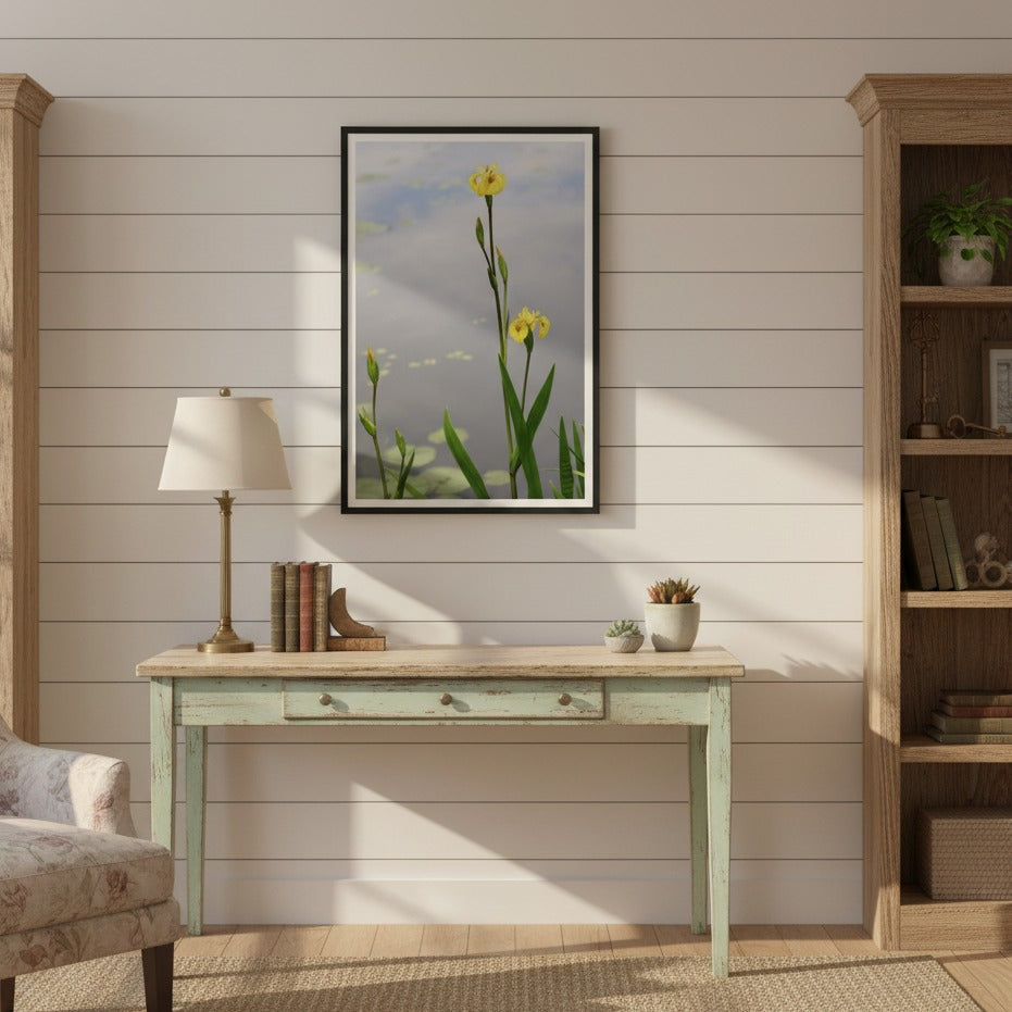 Nest living room with a desk, chair, lamp, and framed picture on a wooden wall - Bromont Media