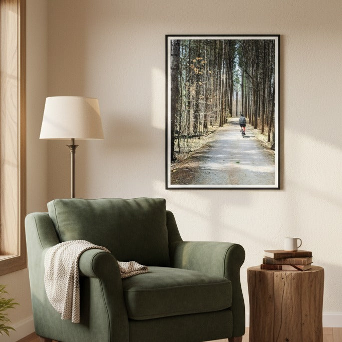 Green armchair in a room with a framed picture of a forest path on the wall - Studio Shefford