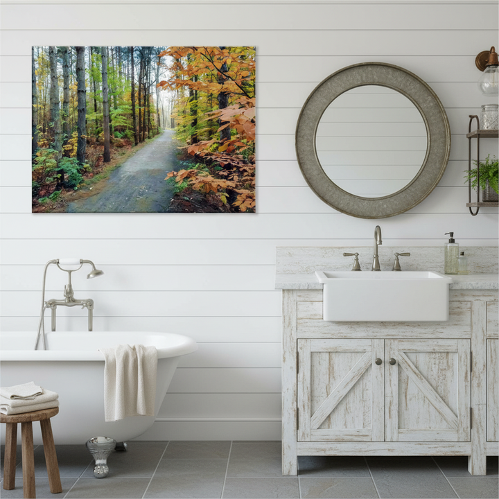 Bathroom with wooden vanity, round mirror, and forest artwork by Studio Shefford on the wall.