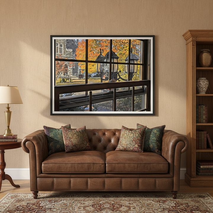 Brown leather sofa with patterned cushions in a living room setting with a framed artwork on the wall - Studio Shefford