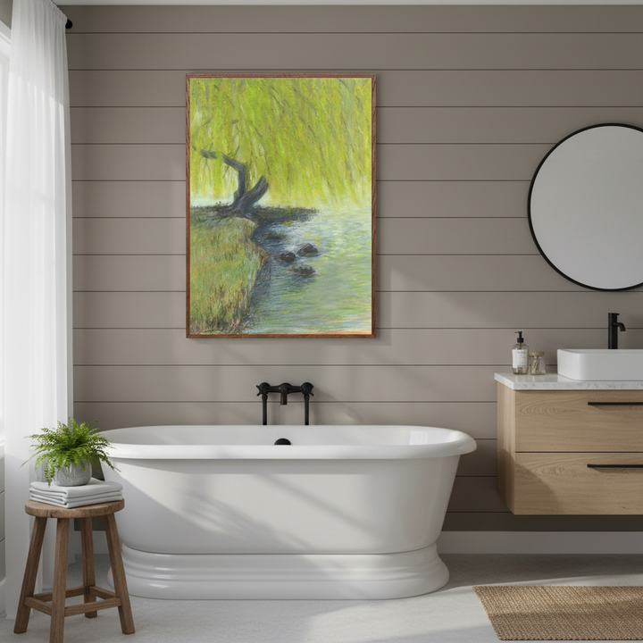 Bathroom with a freestanding bathtub, wooden cabinet, and wall art of a landscape - Bromont Media
