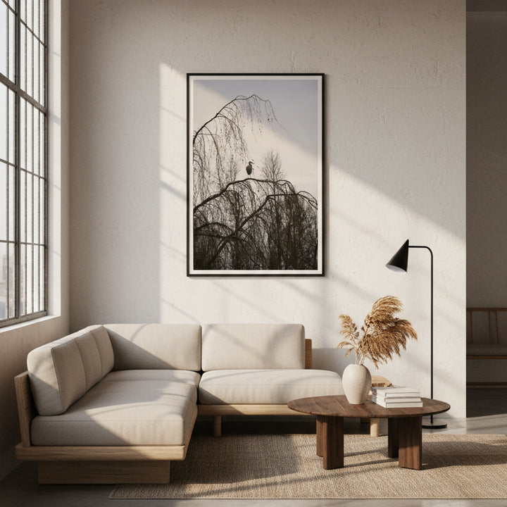 Modern living room with a beige sectional sofa, wooden coffee table, and framed photography of a heron on the wall - by Andrew Semple on Bromont Media