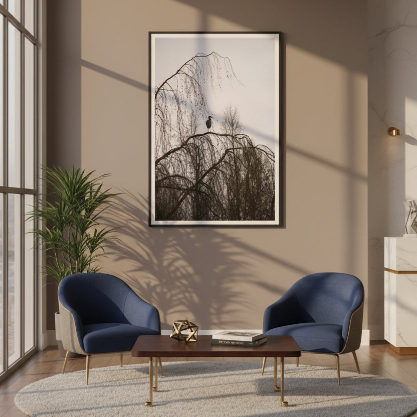 Modern office lobby with two blue chairs, a wooden coffee table, and a framed photography of a heron on the wall - by Andrew Semple on Bromont Media