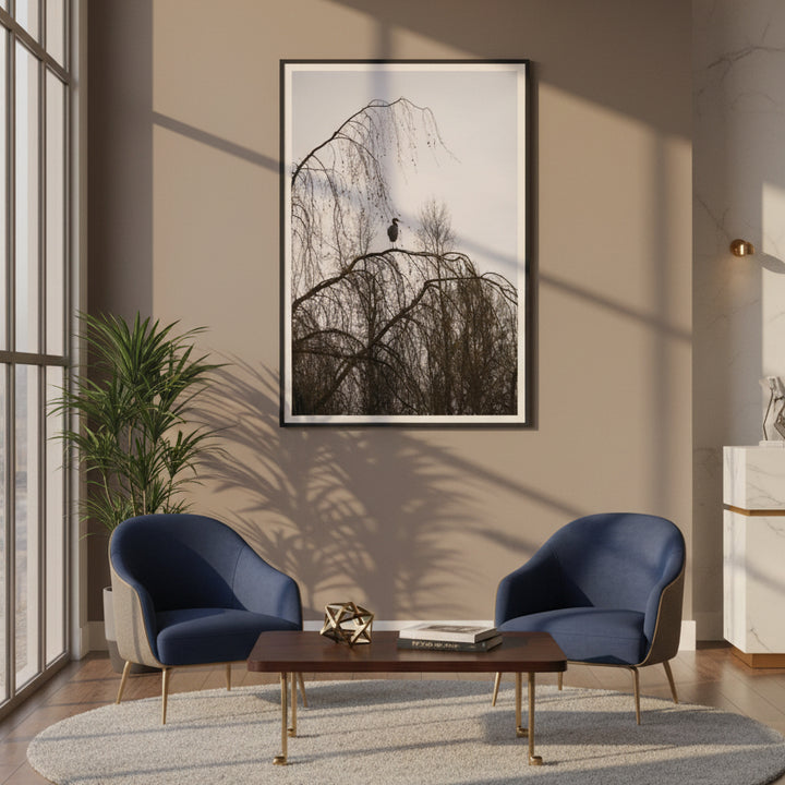 Modern office lobby with two blue chairs, a wooden coffee table, and a framed photography of a heron on the wall - by Andrew Semple on Bromont Media