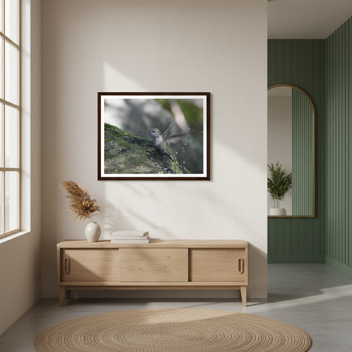 Modern interior with a wooden cabinet, framed picture of a hummingbird, and decorative elements - by Andrew Semple on Bromont Media