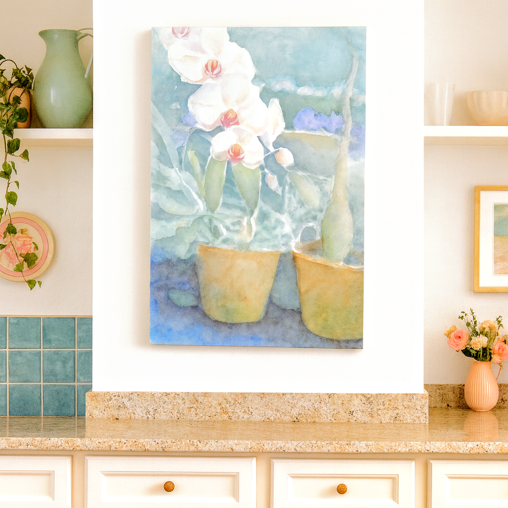Artwork of orchids on a wall above a kitchen counter with decorative elements.