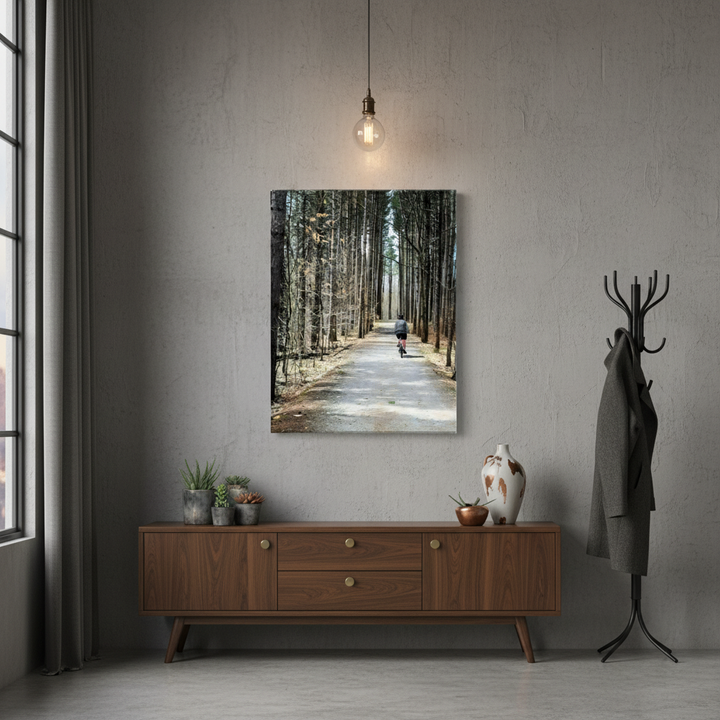 House entryway with a wooden console, coat rack, and wall art of a forest path - by Studio Shefford on Bromont Media