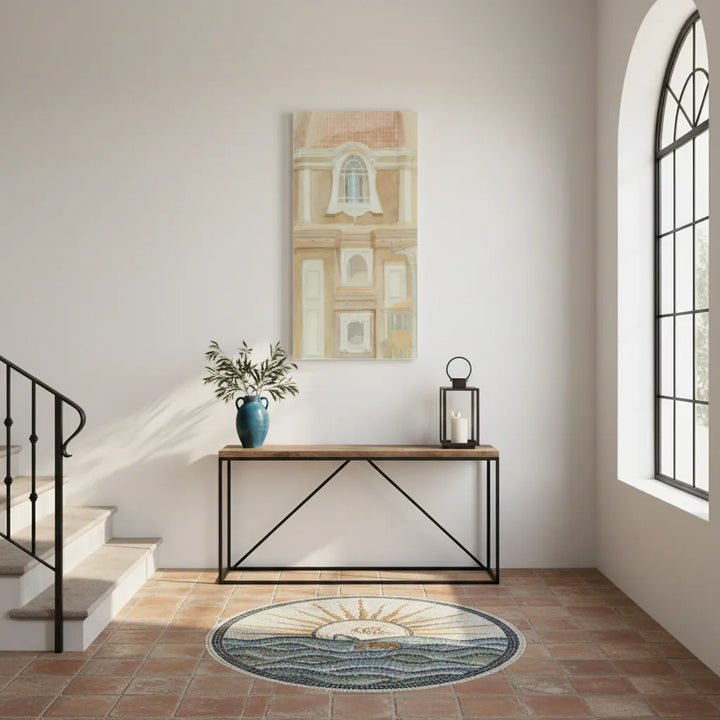 Staircase landing with a wooden console table, decorative plant, and wall art of italian architecture