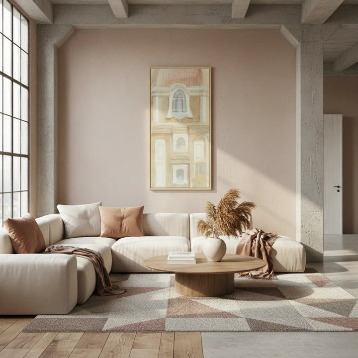 Modern living room with a beige sofa, wooden coffee table, and art on the wall.